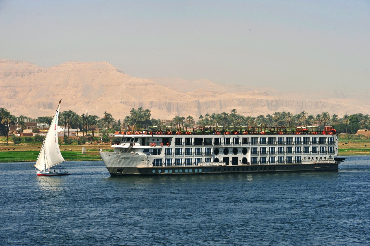 A Nile cruise ship and a dahabiya under sail between Luxor and Aswan